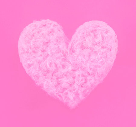 Pink heart made of sweet cotton candy on paper background. Trendy minimal pop art style. Happy...