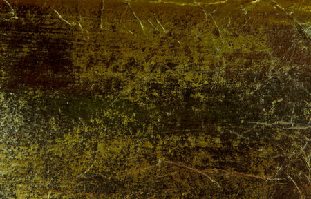 Old grunge paper black texture for background with golden scratches.