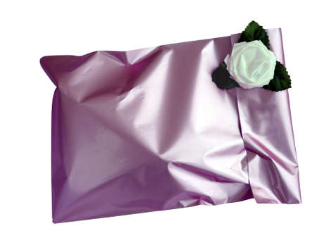 Feminine pink mauve wrapping for this romantic gift - on whiteの写真素材