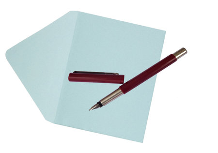 Ink fountain pen with blue envelope isolated on white