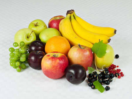 Assortment of fresh fruit on table clothの写真素材