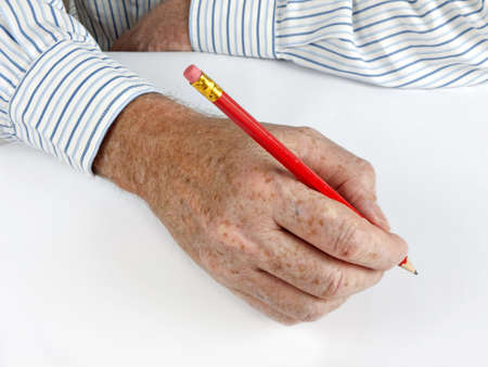 Businessman with pencil and white sheet of paperの写真素材