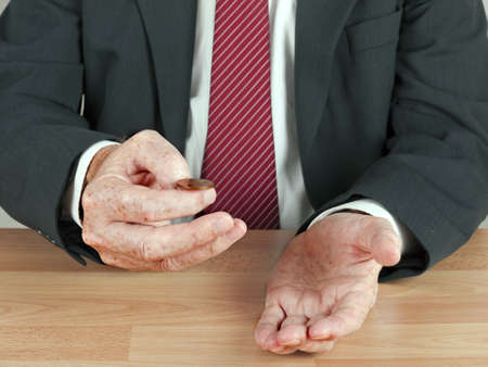 Businessman tossing a uk coin - risk, decision conceptの写真素材