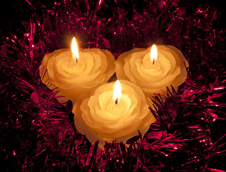Rose shape candles in tinsel - Christmas or festiveの写真素材