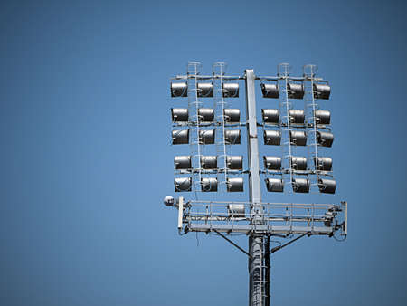 Floodlights against blue skyの写真素材