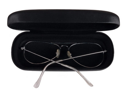 Old spectacles with case, isolated over white