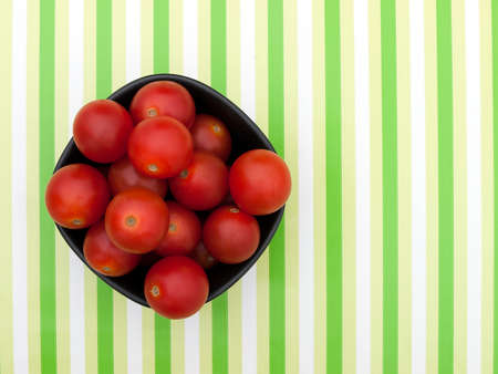 Small red tomatoes in bowlの写真素材