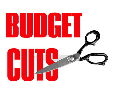 Scissors cutting budget in red - white backgroundの写真素材
