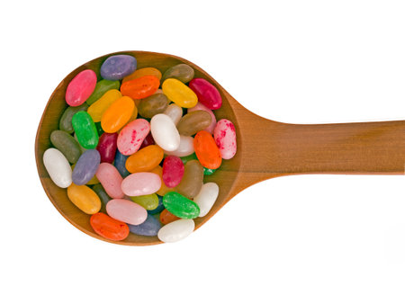 Jolly jelly beans onb spoon, isolated over white background