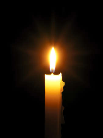 Burning candle with rays - long exposureの写真素材