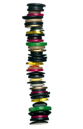 Unusual tower of buttons over white の写真素材