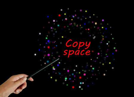 Hand with magic wand - magician with copyspaceの写真素材