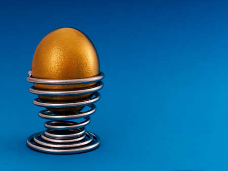 Financial metaphor - golden nest egg with copy space の写真素材