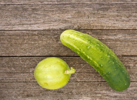 Unusual varieties of cucumber on bench の写真素材