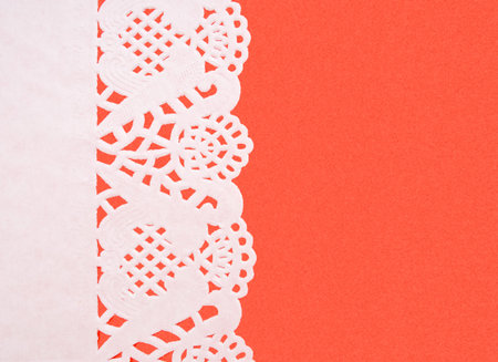 Pretty doily on red backgroundの写真素材
