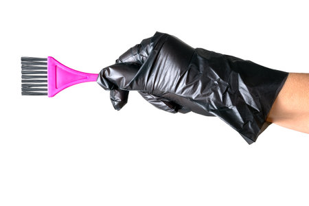 Hairdressing or home tint brush and glove, isolatedの写真素材