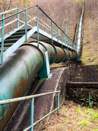 Green energy. Water piped from hills to local power stationの写真素材