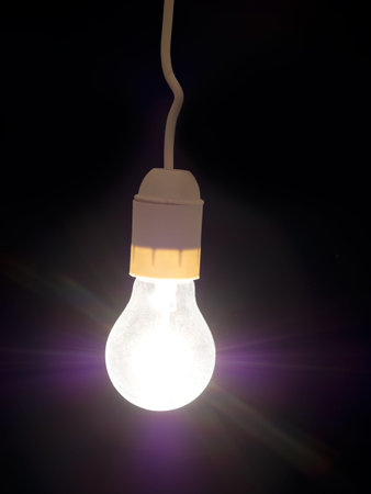 Frosted glass retro light bulb with rays.
