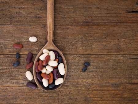 Healthy food background, Beans on old spoon.