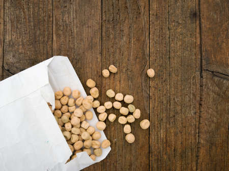 Peas for spring sowing. Rustic wood background.の写真素材