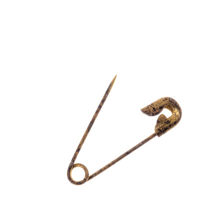 Old and rusty safety pin isolated on white.の写真素材
