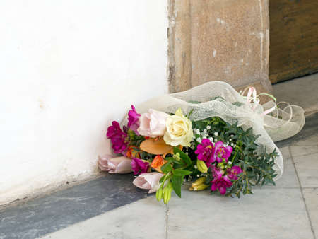 Beautiful flowers outside church, on the ground.の写真素材