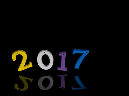 New year 2017. Jolly or teetering, uncertainly or precariously balanced.の写真素材