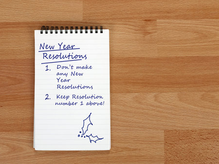 New year resolutions - none. Notepad on desk. With doodle.