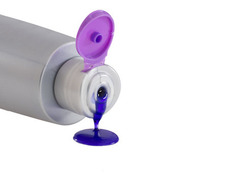 Purple shampoo. Close up. Isolated on white.