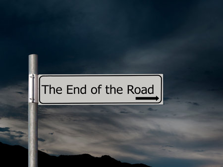 The end of the road, sign over dark, gloomhy cloud sky background. Concept, politics,, Brexit etc.