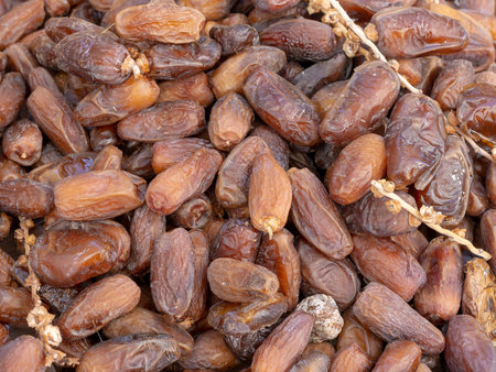 Dried dates on outdoor market stall.