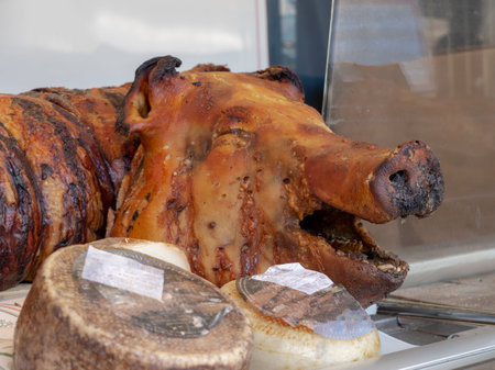 Roasted pig head on street food market stall. Pork.の写真素材