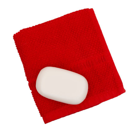 Simple white soap on red face flannel, facecloth, isolated on white background. Health, hygiene, environmentally friendly.の写真素材