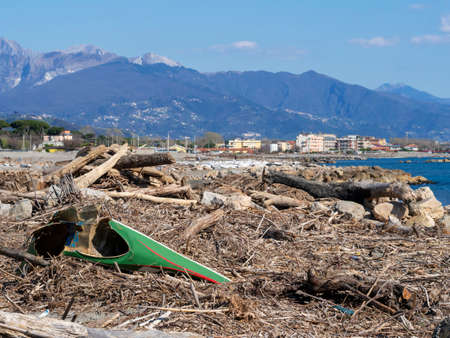 Beach debris after storms, bad weather, Marinella, Lunigiana, 2019.の写真素材