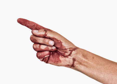 Bloody hand, pointing, blame or accusation, isolated on white. Female.の写真素材