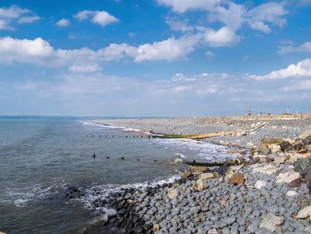 Pebble ridge beach scene at Westward Ho in north Devon, England. No people.