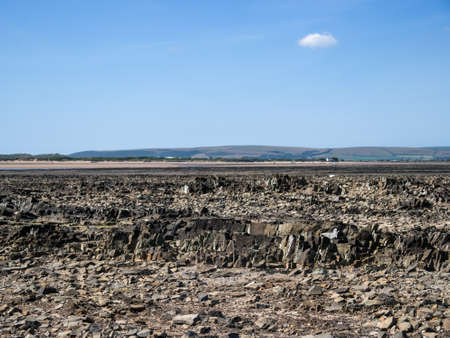 Landscape view of rocky shore between Instow and Yelland, north Devon, UK. Interesting geology.の写真素材