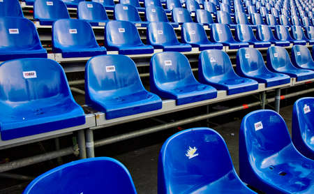 Blue chairs with a number background.の写真素材