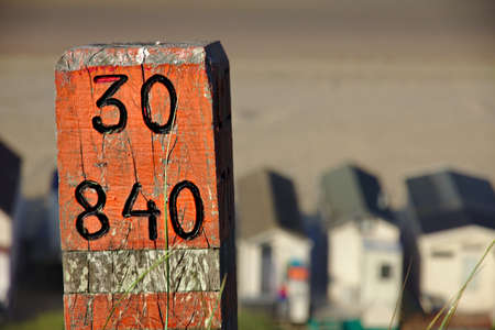 Red wooden with number at beach.の写真素材