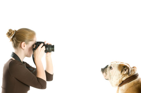 beautiful woman shooting her pet isolated on whiteの写真素材