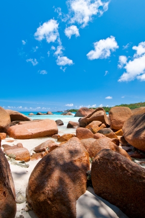 Tropical beach with rocks on white sandの写真素材
