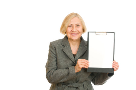 Senior woman holding a clipboard isolated on white backgroundの写真素材