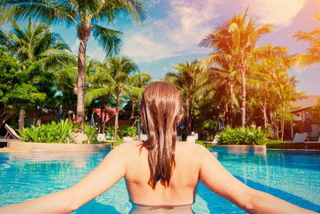 Woman relaxing in swimming pool