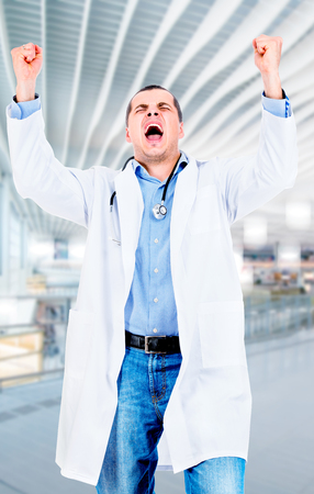 Happy male doctor in the hospitalの写真素材