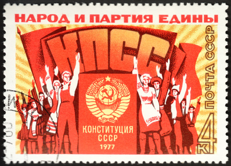 MOSCOW, RUSSIA - DECEMBER, 2015: a post stamp printed in the USSR with the inscription "People and the Party are united" and devoted to the New Constitution, circa 1977のeditorial素材