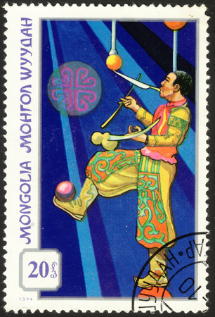 MOSCOW, RUSSIA - DECEMBER, 2015: a post stamp printed in MONGOLIA shows a juggler, the series "Mongolian Circus", circa 1974のeditorial素材