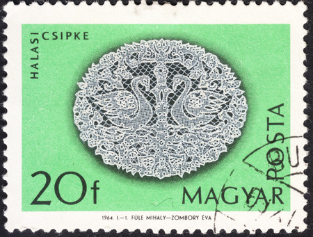 MOSCOW, RUSSIA - JANUARY, 2016: a post stamp printed in HUNGARY shows traditional hungarian lace, the series "Halas Lace", circa 1964のeditorial素材