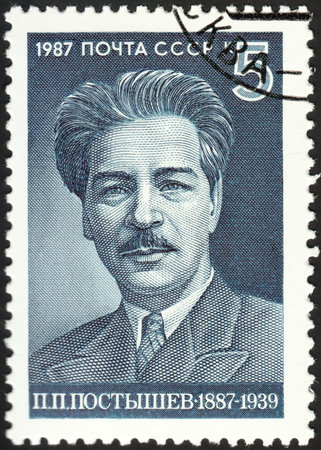 MOSCOW, RUSSIA - DECEMBER, 2015: a post stamp printed in the USSR shows a portrait of P.P.Postyshev, devoted to The 100th Anniversary of the Birth of P.P.Postyshev, circa 1987のeditorial素材
