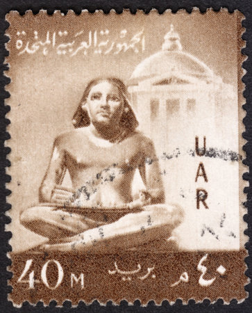MOSCOW, RUSSIA - JANUARY, 2016: a post stamp printed in United Arab Republic (UAR) shows a sculpture of the seated scribe, the series "National Symbols", circa 1959のeditorial素材