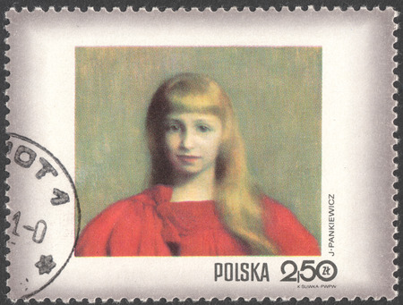 MOSCOW, RUSSIA - CIRCA FEBRUARY, 2016: a post stamp printed in POLAND shows painting "Girl in a red dress" by Jozef Pankiewicz, the series "Women in Polish paintings", circa 1971のeditorial素材